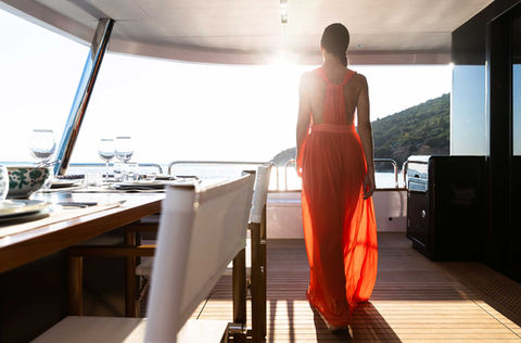 Lady in orange dress. Sirena Yacht with eMotion Hybrid System.